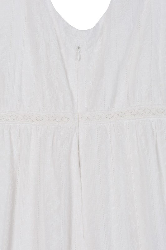 The Embroidered White Dress