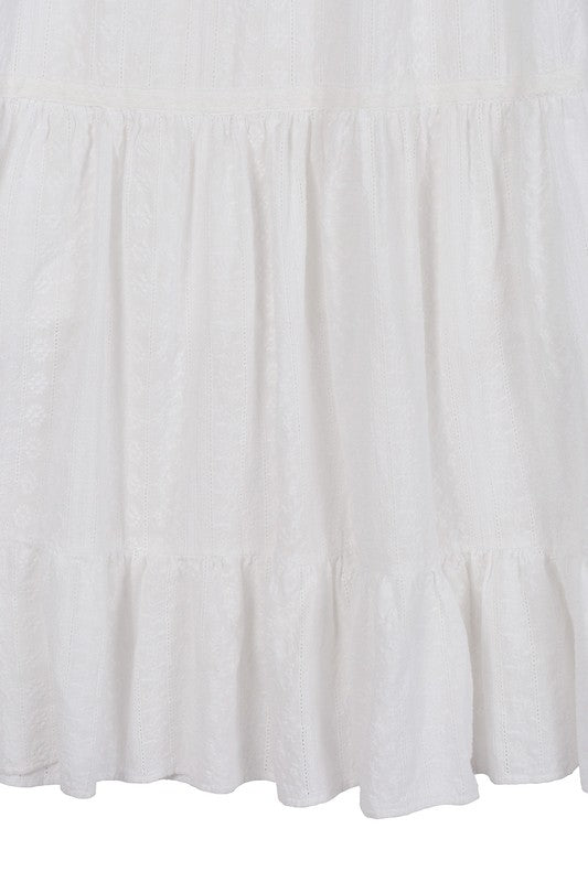 The Embroidered White Dress